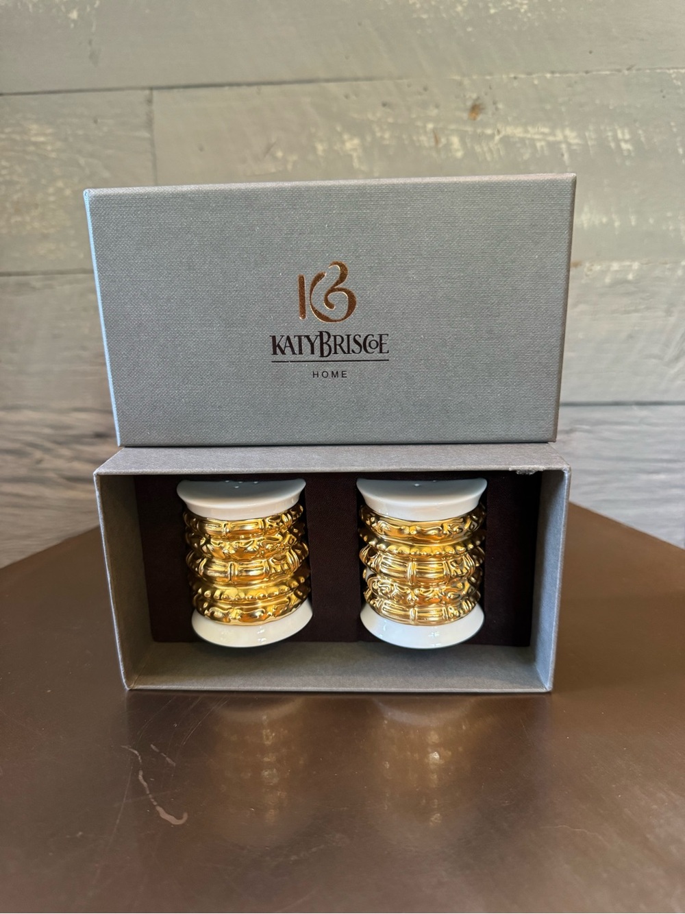 Katy Briscoe salt & pepper shakers made of bone white china with 24 carat gold.
